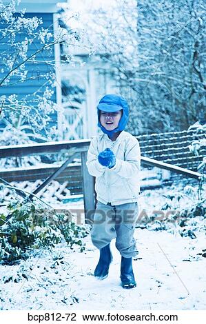 Asian boy playing in snow View Large Photo Image Stock Image - Asian boy playing in snow. Fotosearch