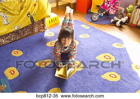 Asian girl reading book View Large Photo Image Stock Photography - Asian girl reading book. Fotosearch