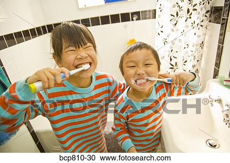 Asian siblings brushing teeth View Large Photo Image Stock Image - Asian siblings brushing teeth. Fotosearch