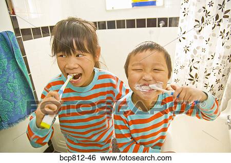 Asian siblings brushing teeth View Large Photo Image Stock Photograph - Asian siblings brushing teeth. Fotosearch