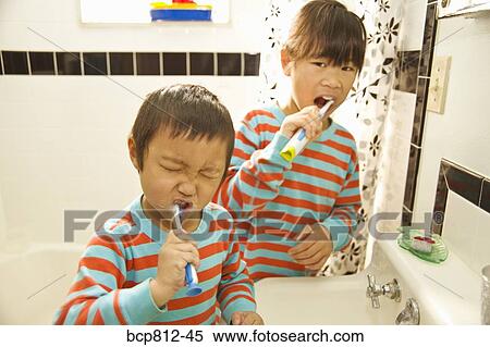 Asian siblings brushing teeth View Large Photo Image Stock Photography - Asian siblings brushing teeth. Fotosearch