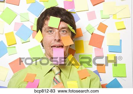 Businessman with adhesive note on forehead View Large Photo Image Stock Image - Businessman with adhesive note on forehead. Fotosearch