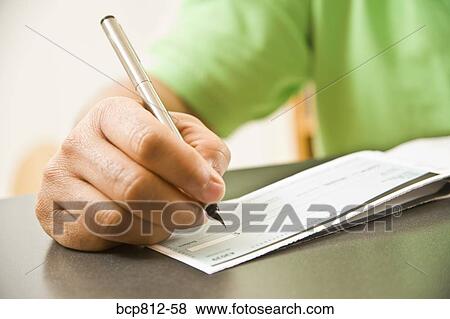 Close up of African man writing check View Large Photo Image Stock Photo - Close up of African man writing check. Fotosearch