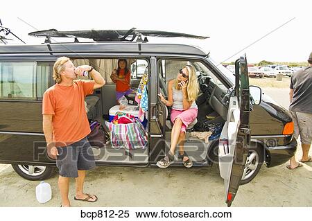 Family relaxing in traveling van View Large Photo Image Stock Photography - Family relaxing in traveling van. Fotosearch