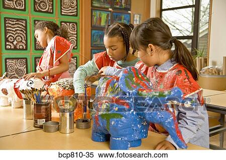 Stock Photography - Multi-ethnic girls making art projects. Fotosearch