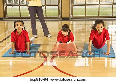 Picture - Multi-ethnic girls practicing yoga. Fotosearch
