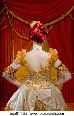 Rear view of woman wearing ornate costume View Large Photo Image Stock Image - Rear view of woman wearing ornate costume. Fotosearch