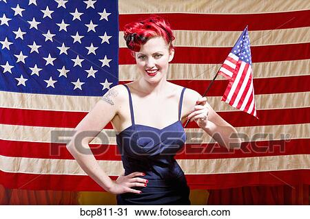 Woman holding American flag View Large Photo Image Stock Image - Woman holding American flag. Fotosearch
