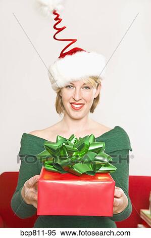 Woman holding Christmas gift View Large Photo Image Stock Photography - Woman holding Christmas gift. Fotosearch
