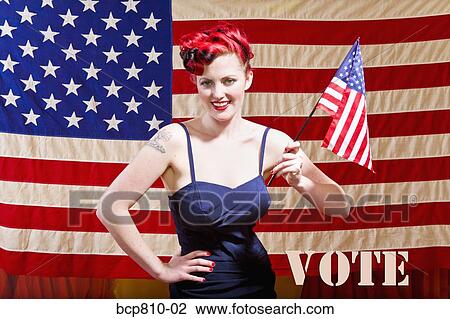 Woman in front of American flag View Large Photo Image Stock Image - Woman in front of American flag. Fotosearch