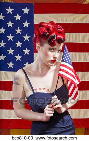 Woman in front of American flag View Large Photo Image Stock Image - Woman in front of American flag. Fotosearch