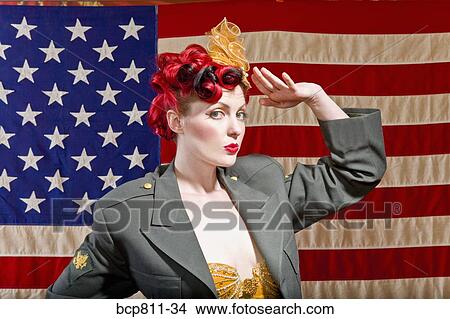 Woman wearing military jacket and saluting View Large Photo Image Picture - Woman wearing military jacket and saluting. Fotosearch