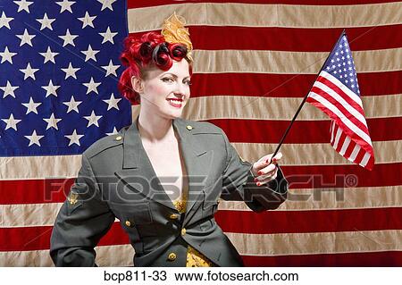 Woman wearing military jacket and holding American flag View Large Photo Image Stock Image - Woman wearing military jacket and holding American flag. Fotosearch