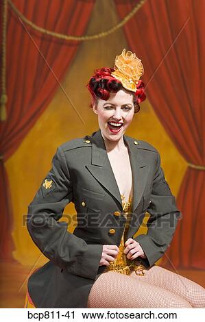 Woman wearing military jacket and winking View Large Photo Image Stock Image - Woman wearing military jacket and winking. Fotosearch