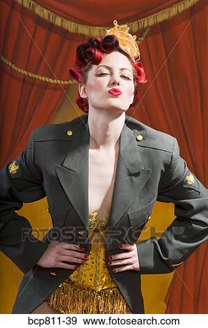 Woman wearing military jacket and blowing kiss View Large Photo Image Stock Photo - Woman wearing military jacket and blowing kiss. Fotosearch