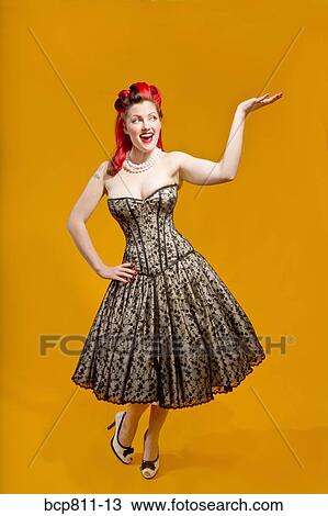 Woman wearing strapless evening gown View Large Photo Image Stock Image - Woman wearing strapless evening gown. Fotosearch