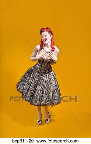 Woman wearing strapless evening gown View Large Photo Image Stock Image - Woman wearing strapless evening gown. Fotosearch