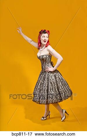 Stock Photo - Woman wearing strapless evening gown. Fotosearch