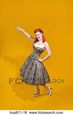 Stock Photo - Woman wearing strapless evening gown. Fotosearch