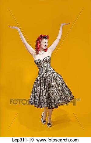 Woman wearing strapless evening gown View Large Photo Image Stock Photo - Woman wearing strapless evening gown. Fotosearch