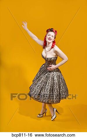 Woman wearing strapless evening gown View Large Photo Image Stock Photograph - Woman wearing strapless evening gown. Fotosearch