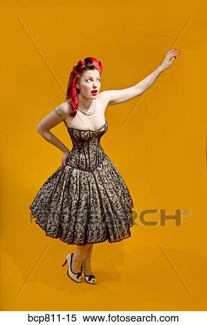 Woman wearing strapless evening gown View Large Photo Image Stock Photography - Woman wearing strapless evening gown. Fotosearch