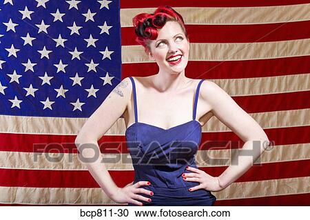 Woman with hands on hips in front of American flag View Large Photo Image Stock Image - Woman with hands on hips in front of American flag. Fotosearch