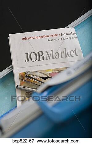 Briefcase, eyeglasses and employment section of newspaper View Large Photo Image Stock Photo - Briefcase, eyeglasses and employment section of newspaper. Fotosearch
