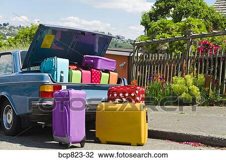 Car trunk loaded with colorful suitcases View Large Photo Image Stock Image - Car trunk loaded with colorful suitcases. Fotosearch