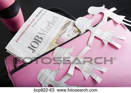 Stock Image - Paper dolls, briefcase and employment section of newspaper. Fotosearch