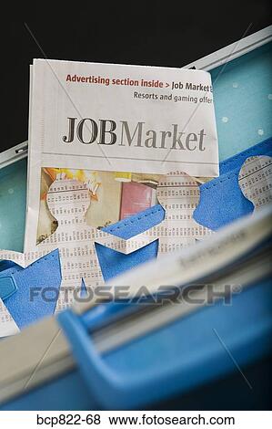 Paper dolls, briefcase and employment section of newspaper View Large Photo Image Stock Photo - Paper dolls, briefcase and employment section of newspaper. Fotosearch