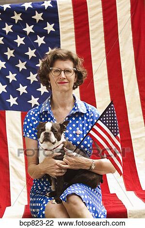 Patriotic woman and Boston Terrier dog posing with American flag View Large Photo Image Stock Image - Patriotic woman and Boston Terrier dog posing with American flag. Fotosearch