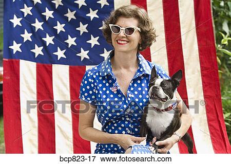 Patriotic woman and Boston Terrier dog posing with American flag View Large Photo Image Stock Photo - Patriotic woman and Boston Terrier dog posing with American flag. Fotosearch