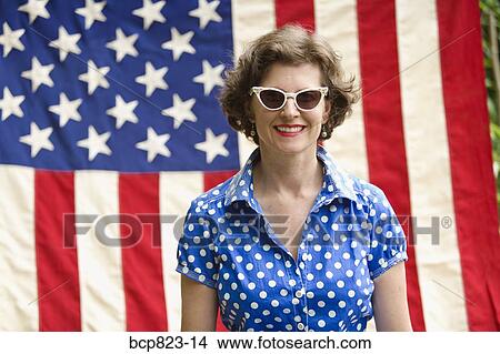 Patriotic woman posing with American flag View Large Photo Image Picture - Patriotic woman posing with American flag. Fotosearch