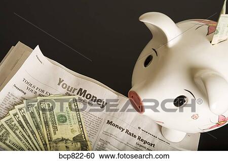 Piggy bank, cash and financial section of newspaper View Large Photo Image Stock Image - Piggy bank, cash and financial section of newspaper. Fotosearch