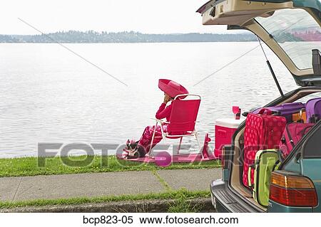 Woman and dog relaxing by bay View Large Photo Image Stock Photography - Woman and dog relaxing by bay. Fotosearch