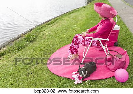 Woman in pink and Boston Terrier dog picnicking by bay View Large Photo Image Stock Image - Woman in pink and Boston Terrier dog picnicking by bay. Fotosearch