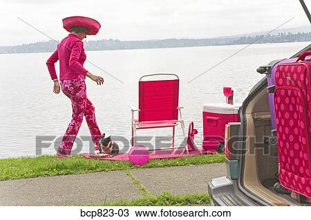 Woman in pink and Boston Terrier dog picnicking by bay View Large Photo Image Stock Image - Woman in pink and Boston Terrier dog picnicking by bay. Fotosearch