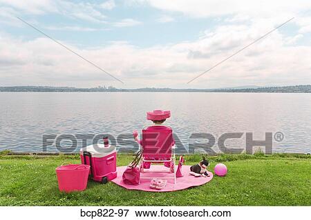 Woman in pink and Boston Terrier dog picnicking by bay View Large Photo Image Stock Photo - Woman in pink and Boston Terrier dog picnicking by bay. Fotosearch