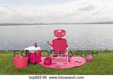 Woman in pink picnicking by bay View Large Photo Image Stock Photography - Woman in pink picnicking by bay. Fotosearch