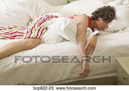 Woman sleeping in bed View Large Photo Image Stock Image - Woman sleeping in bed. Fotosearch