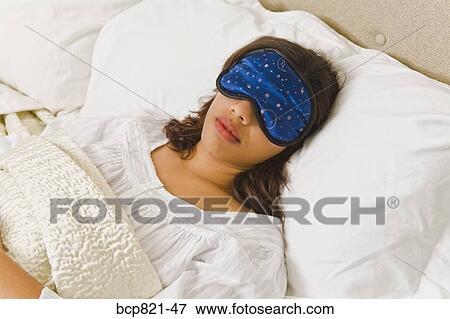Woman sleeping with eye mask View Large Photo Image Stock Photo - Woman sleeping with eye mask. Fotosearch