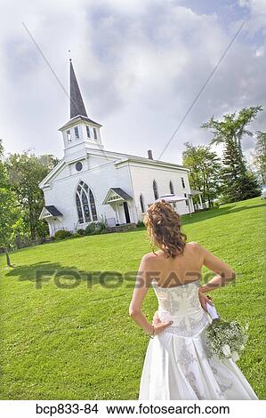 Bride standing near a church, East Meredith, New York State, USA View Large Photo Image Picture - Bride standing near a church, East Meredith, New York State, USA. Fotosearch