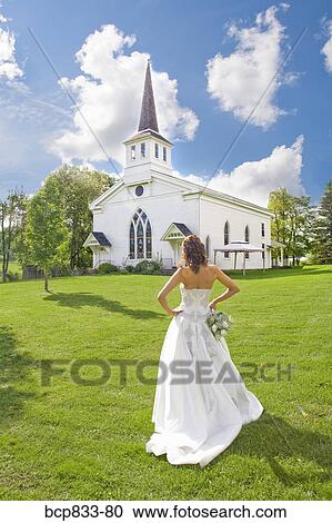 Bride standing near a church, East Meredith, New York State, USA View Large Photo Image Stock Image - Bride standing near a church, East Meredith, New York State, USA. Fotosearch