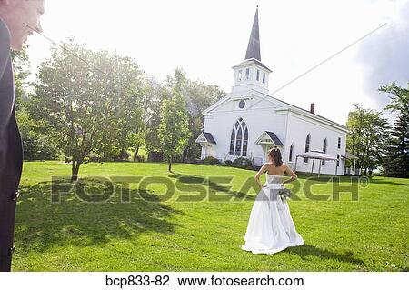 Bride standing near a church, East Meredith, New York State, USA View Large Photo Image Stock Image - Bride standing near a church, East Meredith, New York State, USA. Fotosearch