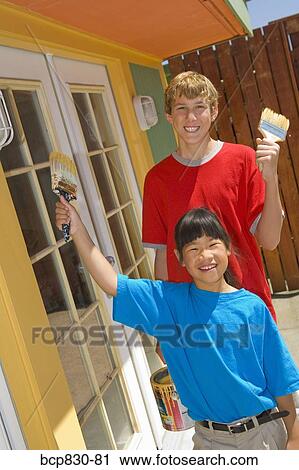 Children painting their home View Large Photo Image Stock Image - Children painting their home. Fotosearch