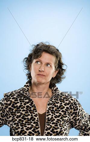 Close-up of a woman staring View Large Photo Image Stock Photo - Close-up of a woman staring. Fotosearch