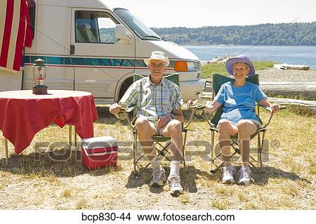 Couple at a beach, Washington State, USA View Large Photo Image Picture - Couple at a beach, Washington State, USA. Fotosearch