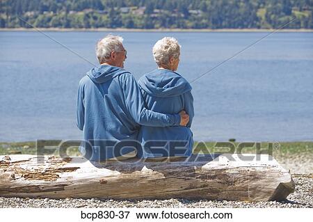 Stock Photo - Couple at a beach, Washington State, USA. Fotosearch