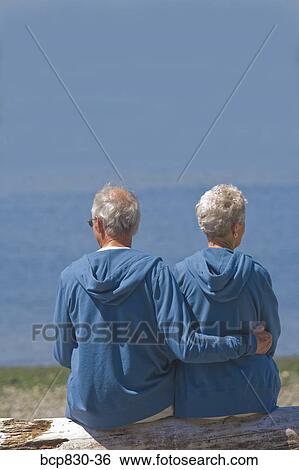 Couple at a beach, Washington State, USA View Large Photo Image Stock Photograph - Couple at a beach, Washington State, USA. Fotosearch